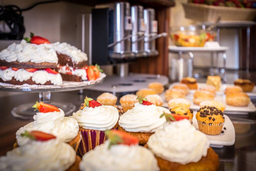 Homemade cakes, muffins and pastries at the breakfast buffet