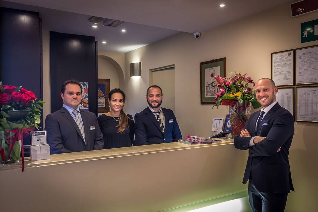 Reception staff at the 24-hour front desk of Hotel Duomo Firenze