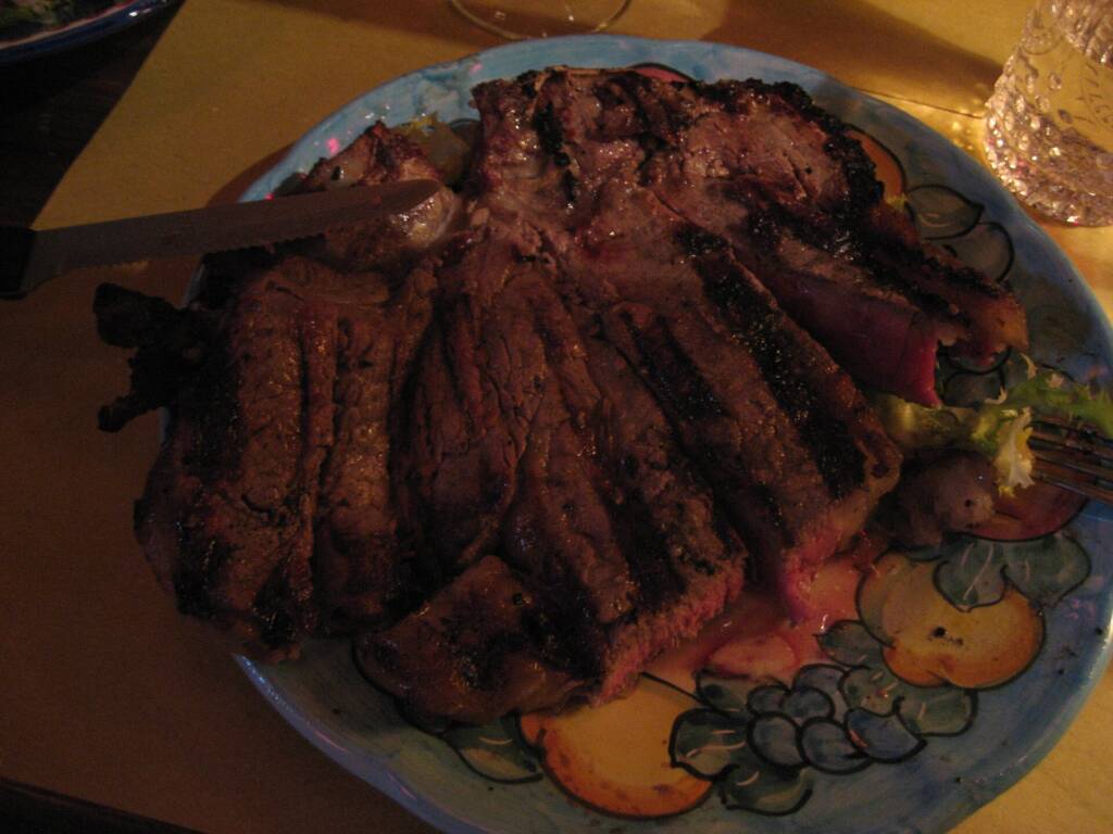 Sliced bistecca alla fiorentina cooked rare