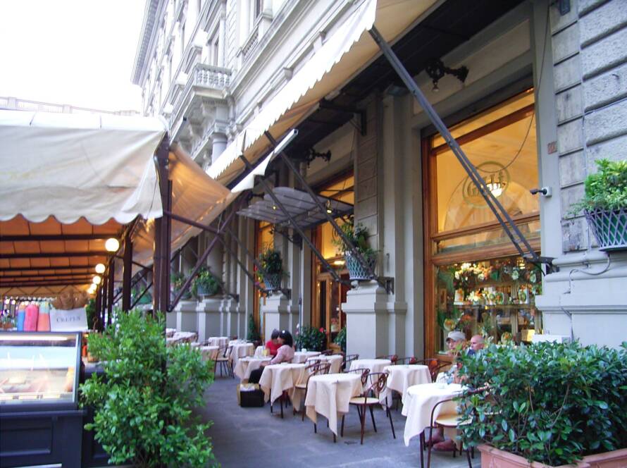 Café terrace with outdoor tables in the historic center of Florence